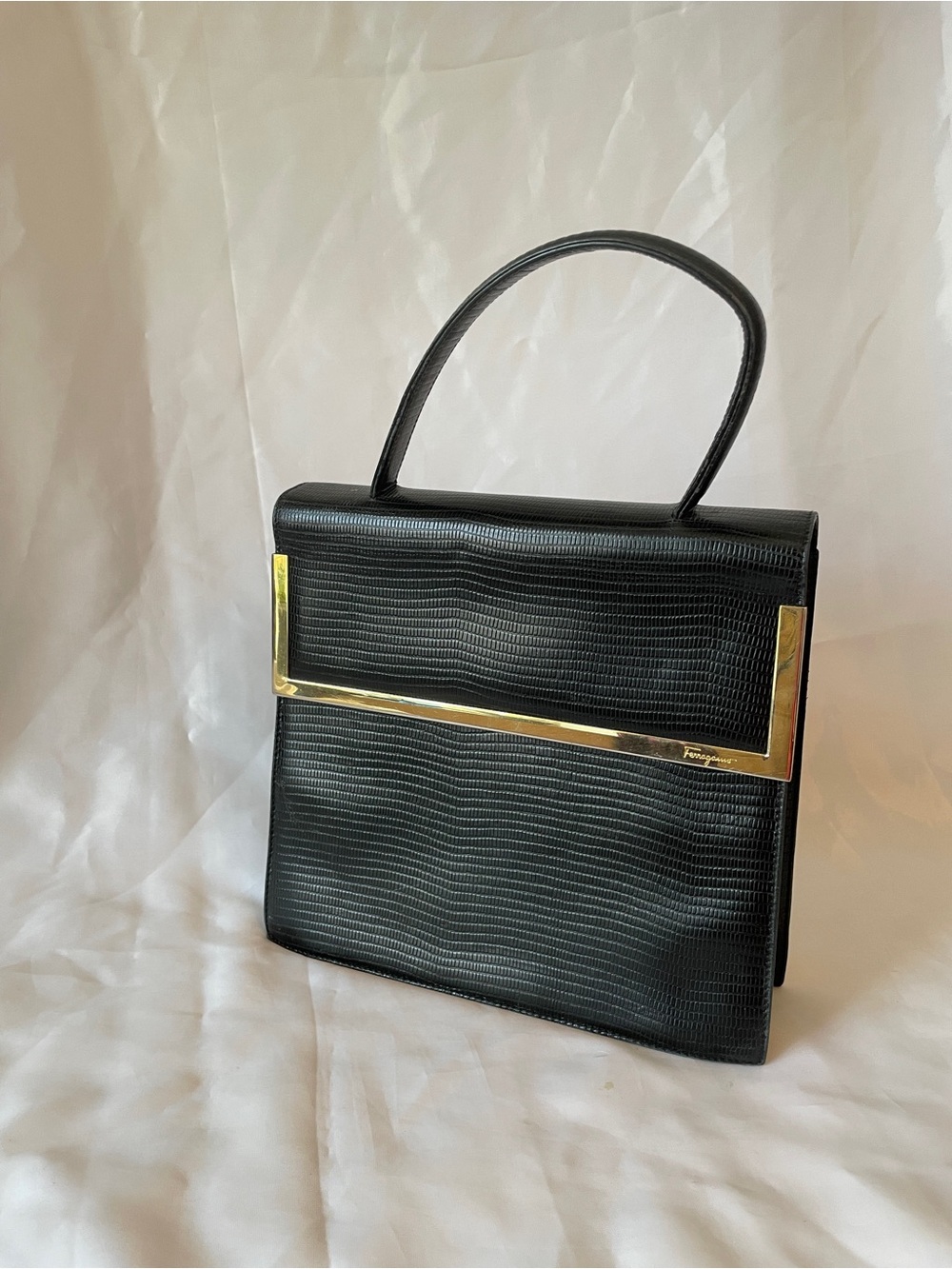 Salvatore Ferragamo Black Satchel with Gold Bar Accent